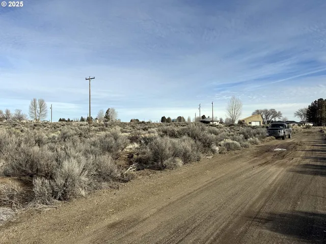 a view of a backyard of the house