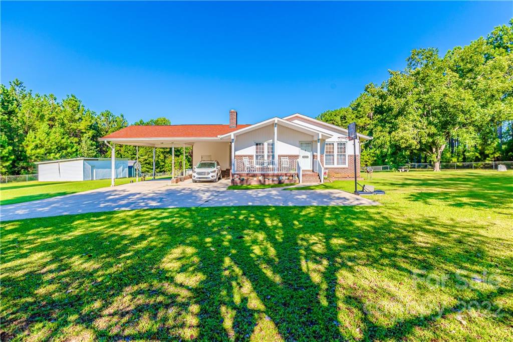 8264 Lockhart Road Sharon, SC 29742 - Photo 1 of 46 a view of a house with a big yard