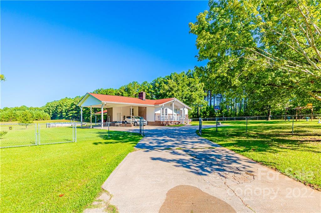 8264 Lockhart Road Sharon, SC 29742 - Photo 2 of 46 a view of a house with a big yard