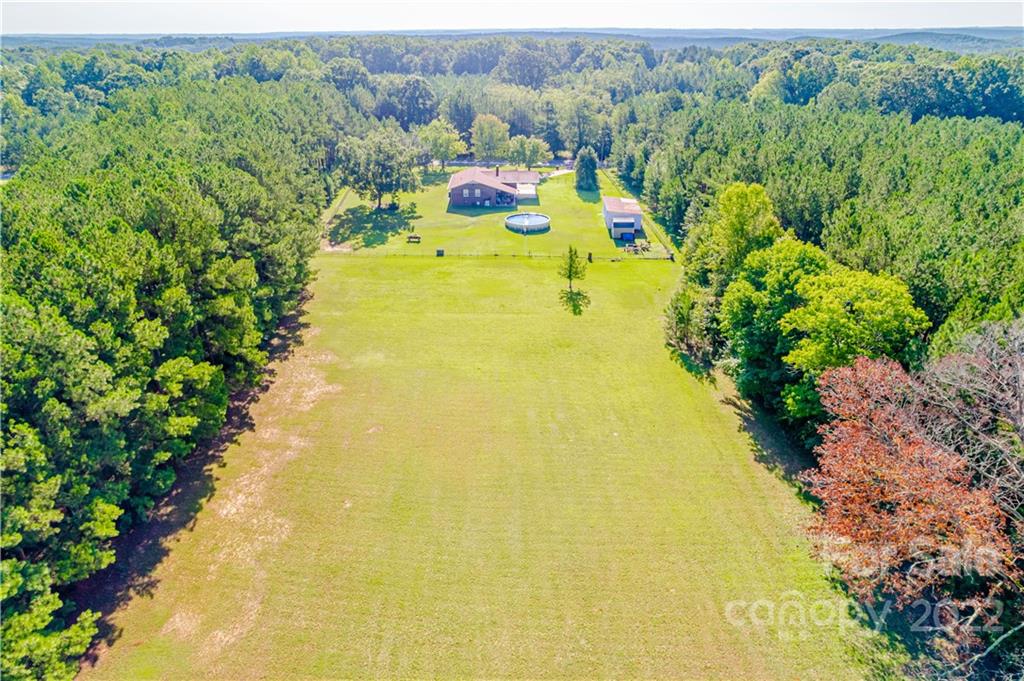 8264 Lockhart Road Sharon, SC 29742 - Photo 21 of 46 a view of a swimming pool with a yard