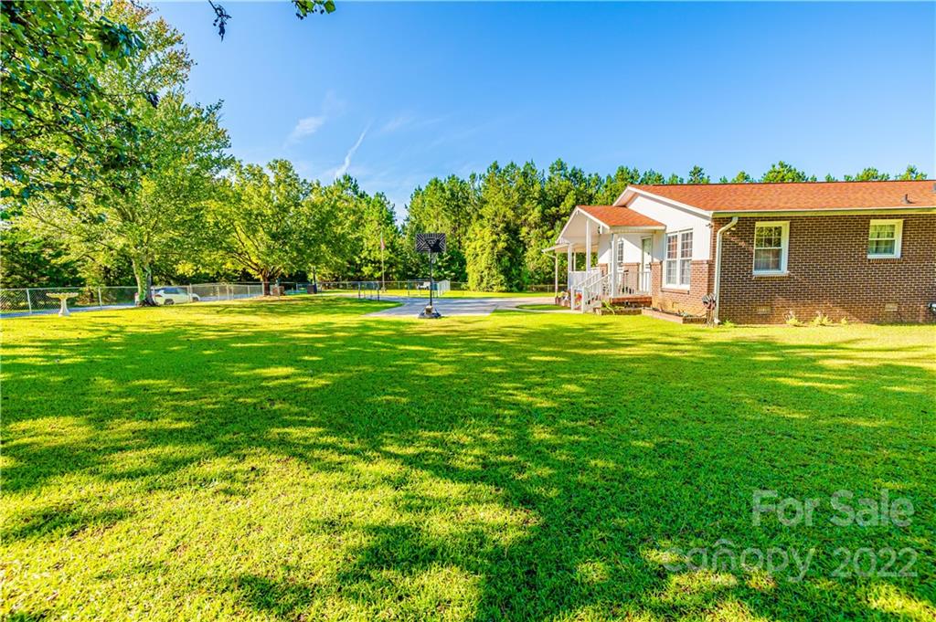 8264 Lockhart Road Sharon, SC 29742 - Photo 3 of 46 a view of a house with a big yard