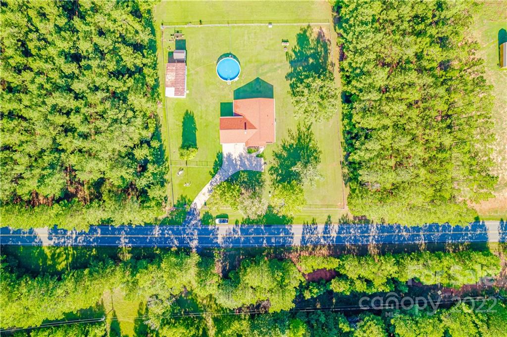 8264 Lockhart Road Sharon, SC 29742 - Photo 34 of 46 a view of swimming pool with a yard and outdoor seating