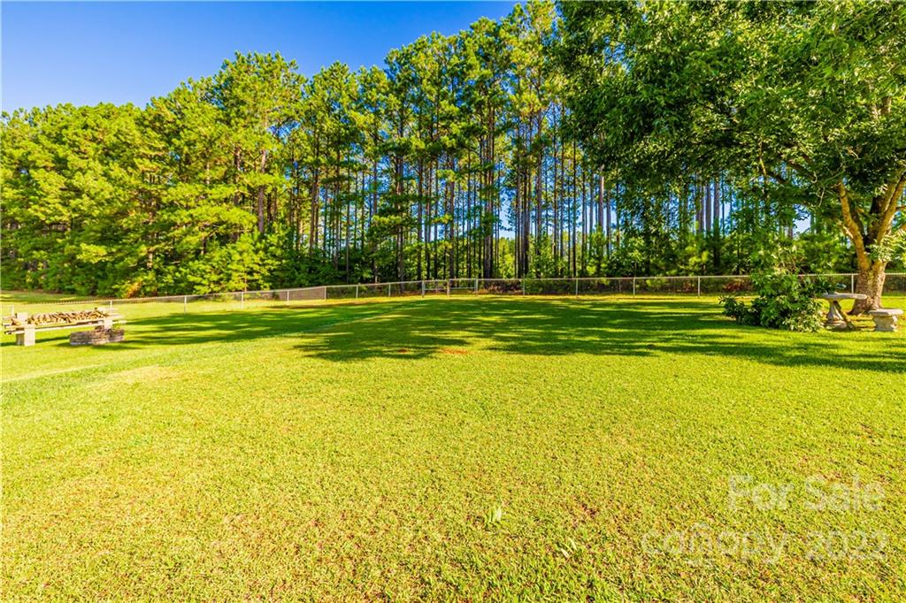 8264 Lockhart Road Sharon, SC 29742 - Photo 44 of 46 a view of a swimming pool with an outdoor space and seating area