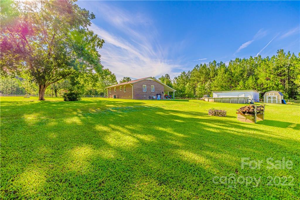 8264 Lockhart Road Sharon, SC 29742 - Photo 46 of 46 a view of a big yard with a house in the background