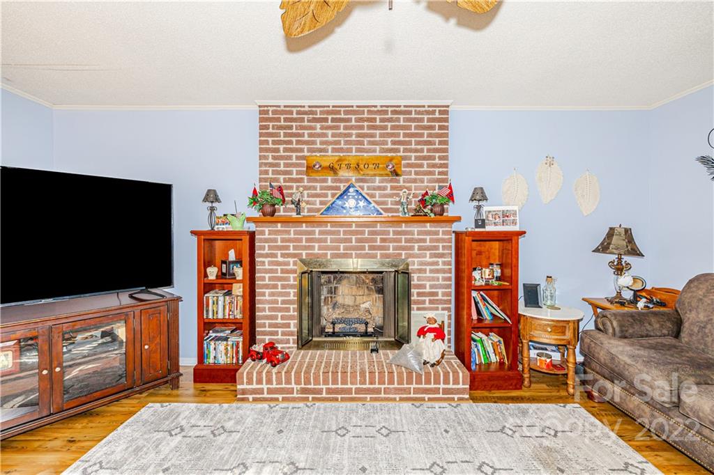 8264 Lockhart Road Sharon, SC 29742 - Photo 7 of 46 a living room with furniture and a fireplace
