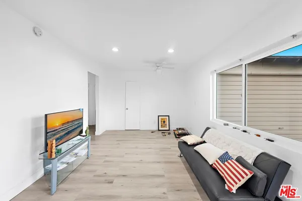 a spacious bedroom with a bed and a couch