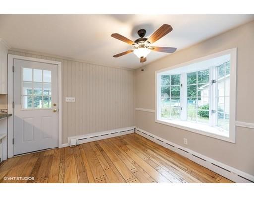 119 White Oak Road Springfield, MA 01128 - Photo 5 of 21 a view of an empty room with wooden floor and a window