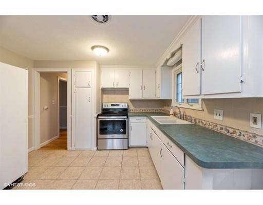 119 White Oak Road Springfield, MA 01128 - Photo 6 of 21 a kitchen with stainless steel appliances granite countertop a sink stove and refrigerator