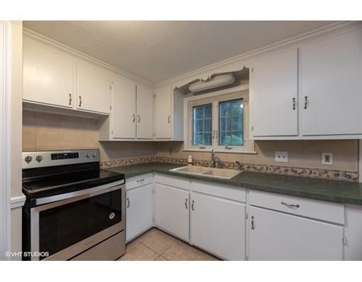 119 White Oak Road Springfield, MA 01128 - Photo 8 of 21 a kitchen with granite countertop a stove sink and cabinets