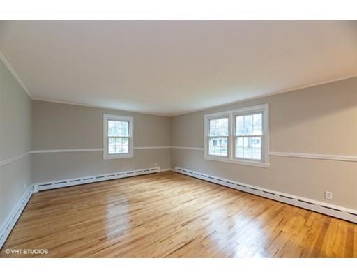 119 White Oak Road Springfield, MA 01128 - Photo 9 of 21 a view of an empty room with wooden floor and a window