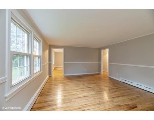 119 White Oak Road Springfield, MA 01128 - Photo 10 of 21 a view of an empty room with wooden floor and a window