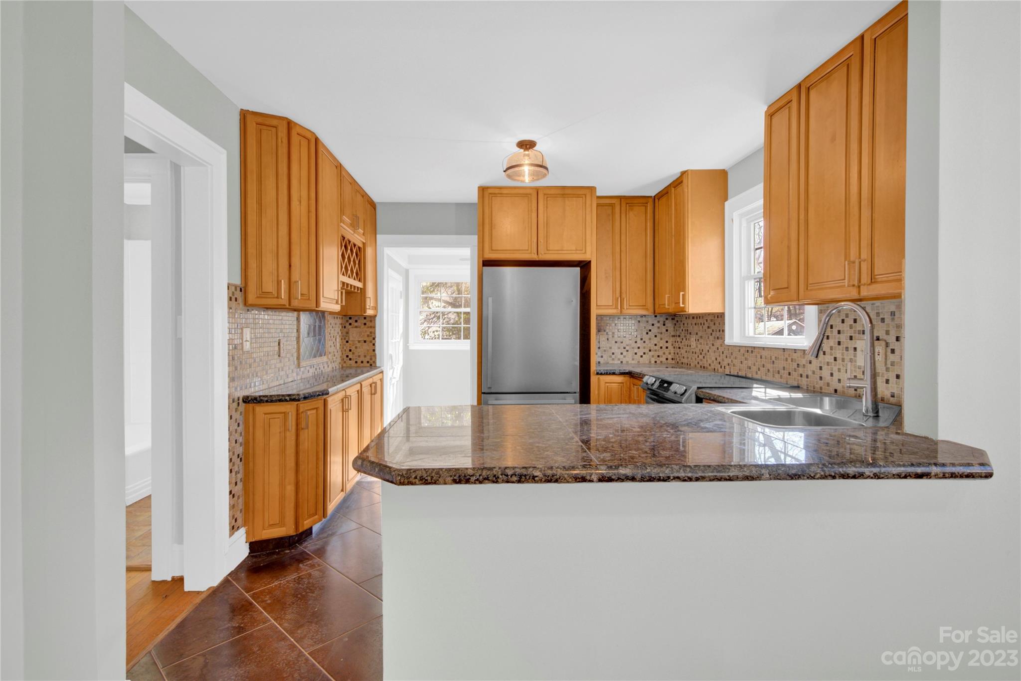 201 Knox Street Clover, SC 29710 - Photo 11 of 34 a kitchen with stainless steel appliances granite countertop a refrigerator and a sink