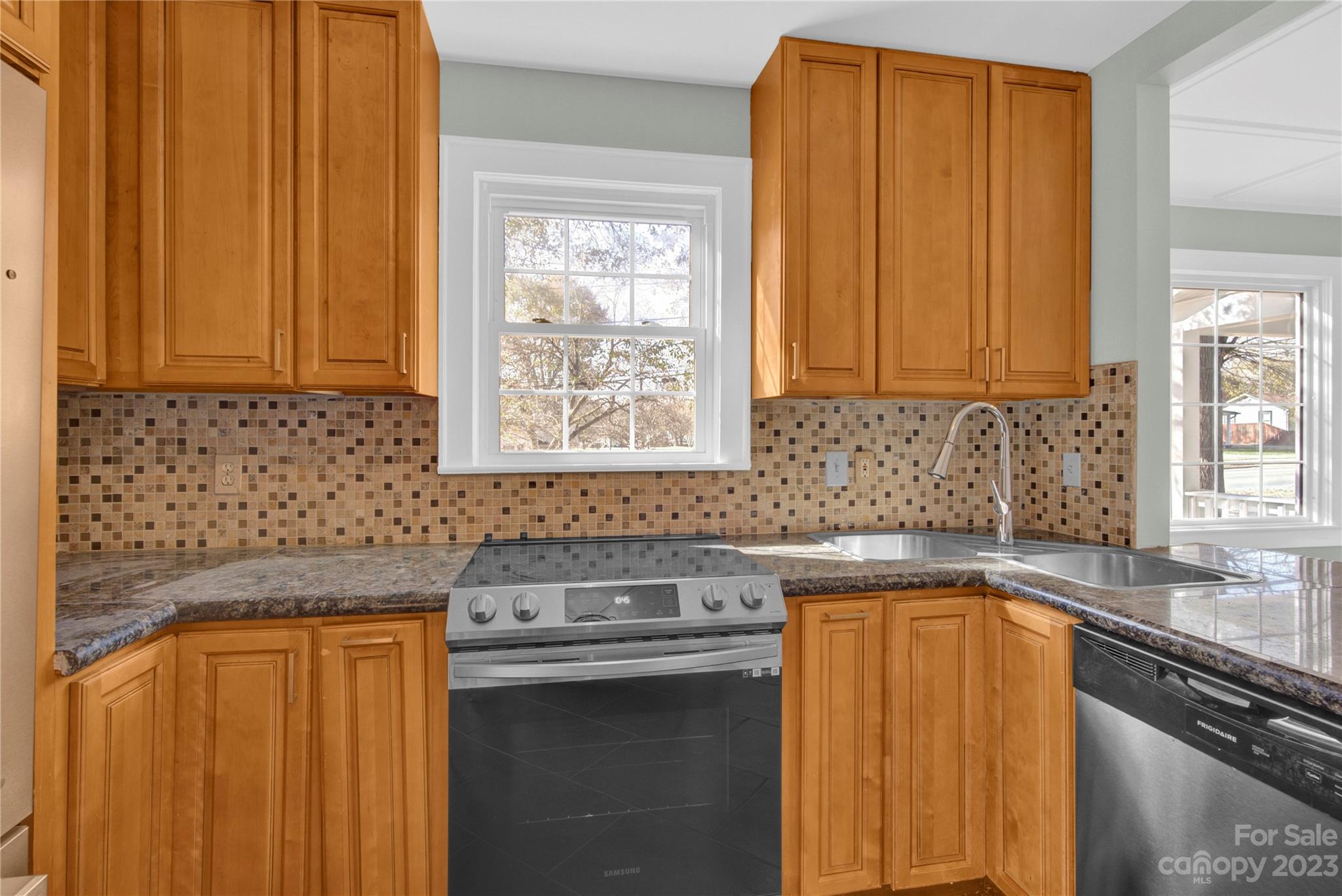 201 Knox Street Clover, SC 29710 - Photo 13 of 34 a kitchen with stainless steel appliances granite countertop a sink stove and cabinets