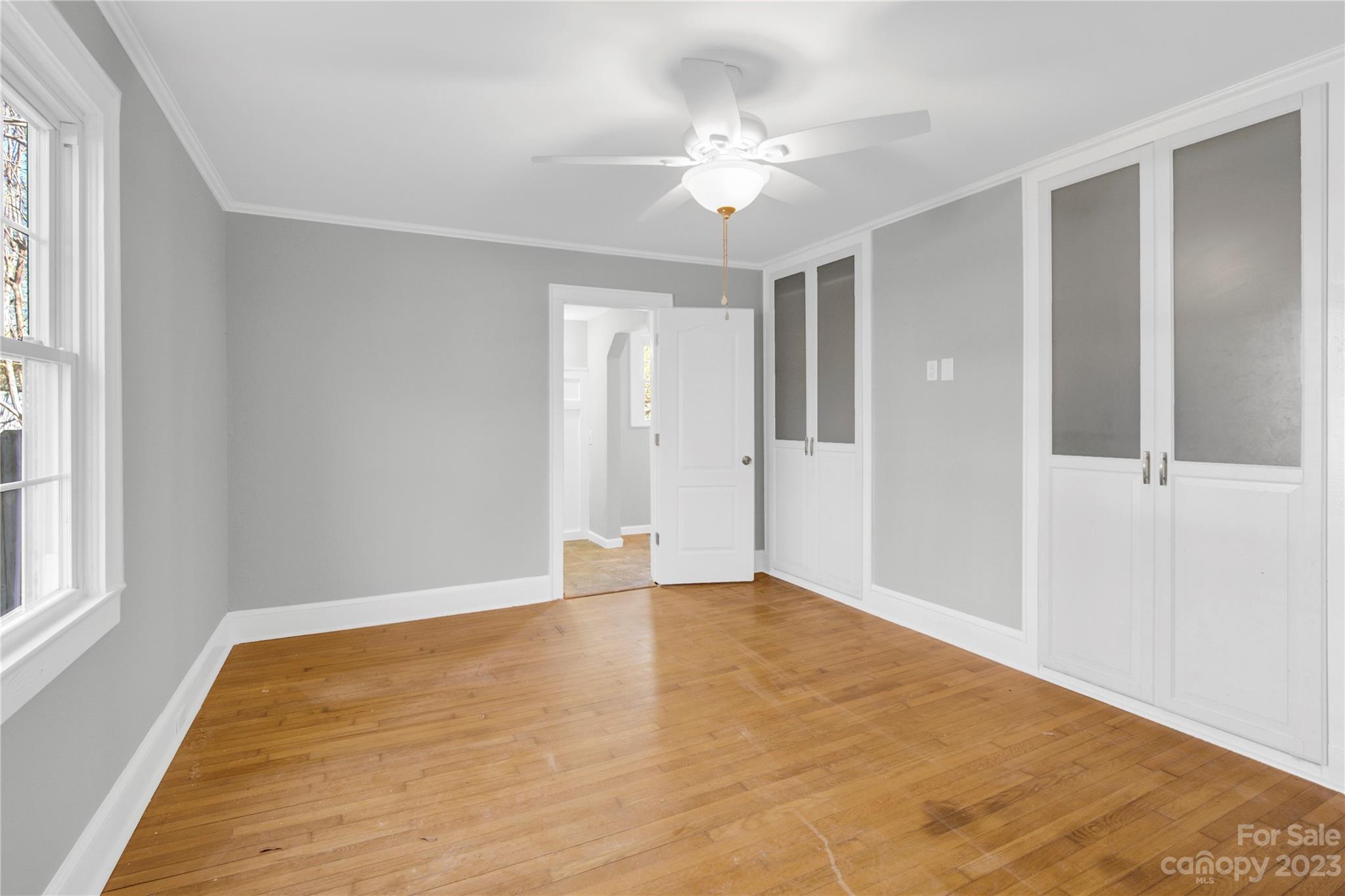 201 Knox Street Clover, SC 29710 - Photo 16 of 34 a view of an empty room with window and chandelier fan