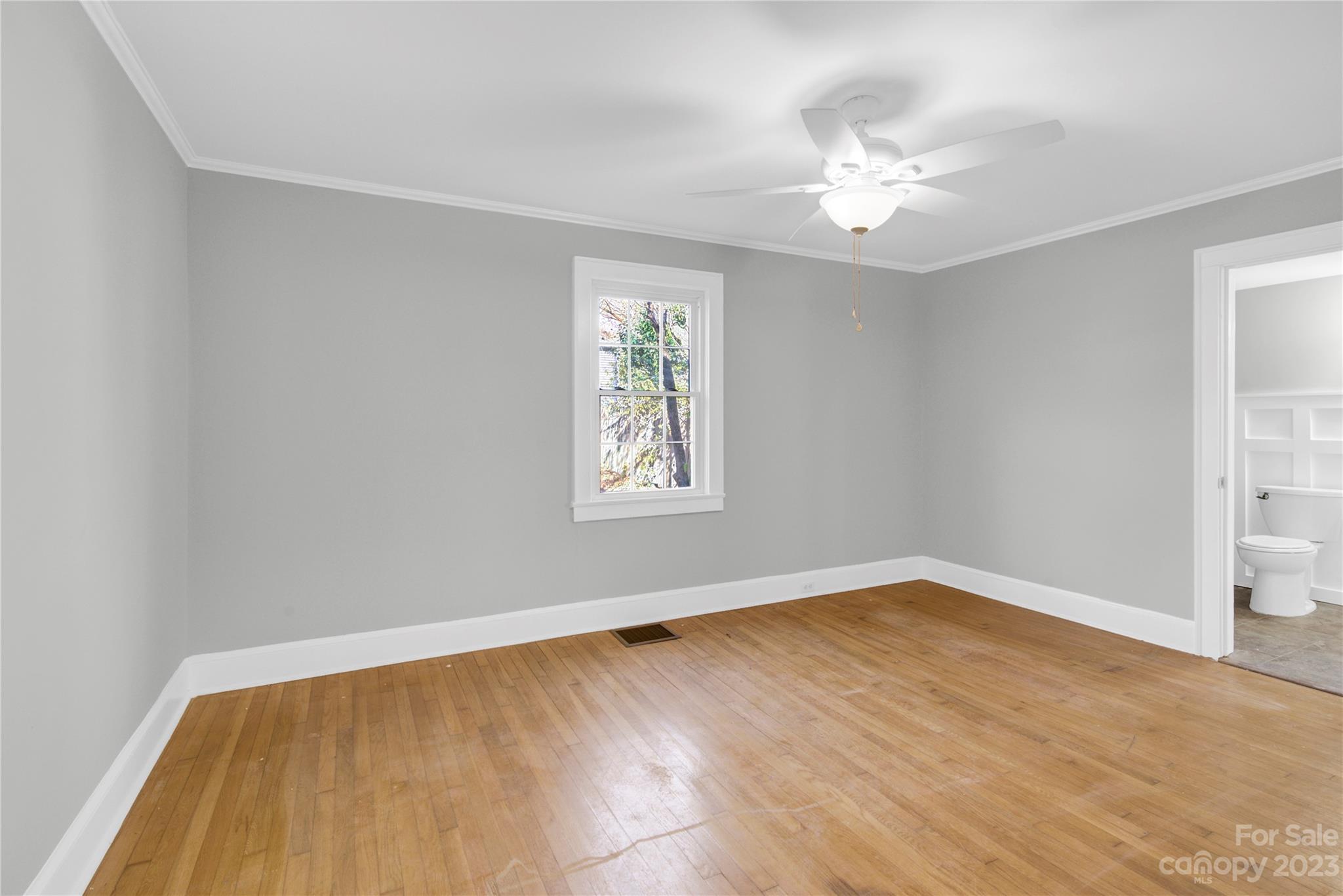 201 Knox Street Clover, SC 29710 - Photo 18 of 34 a view of an empty room with wooden floor and a window