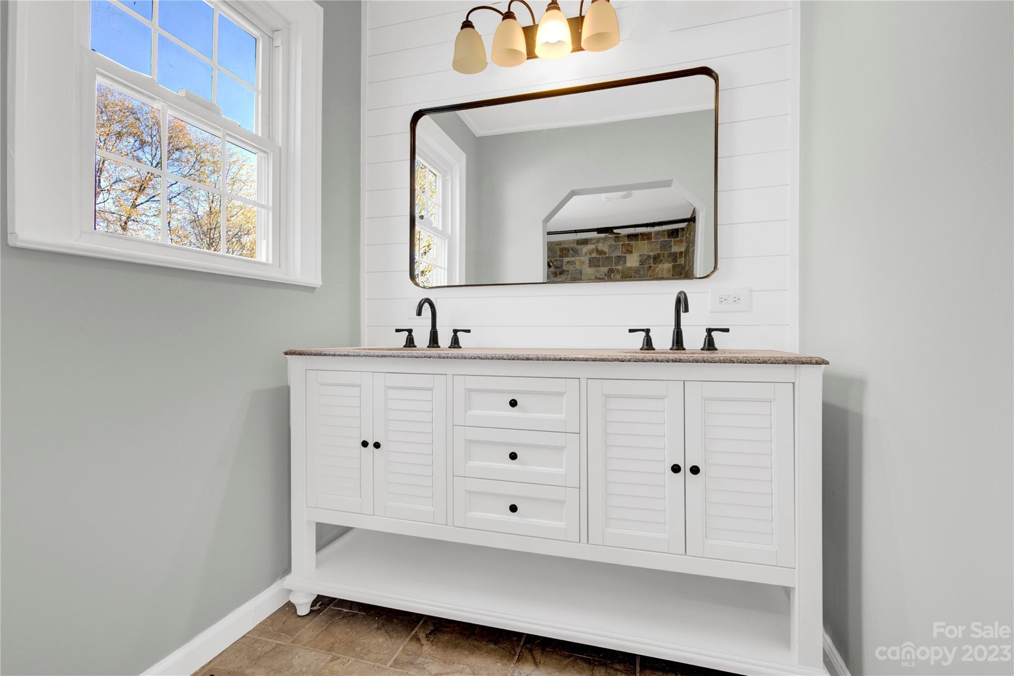 201 Knox Street Clover, SC 29710 - Photo 21 of 34 a bathroom with a double vanity sink and a mirror