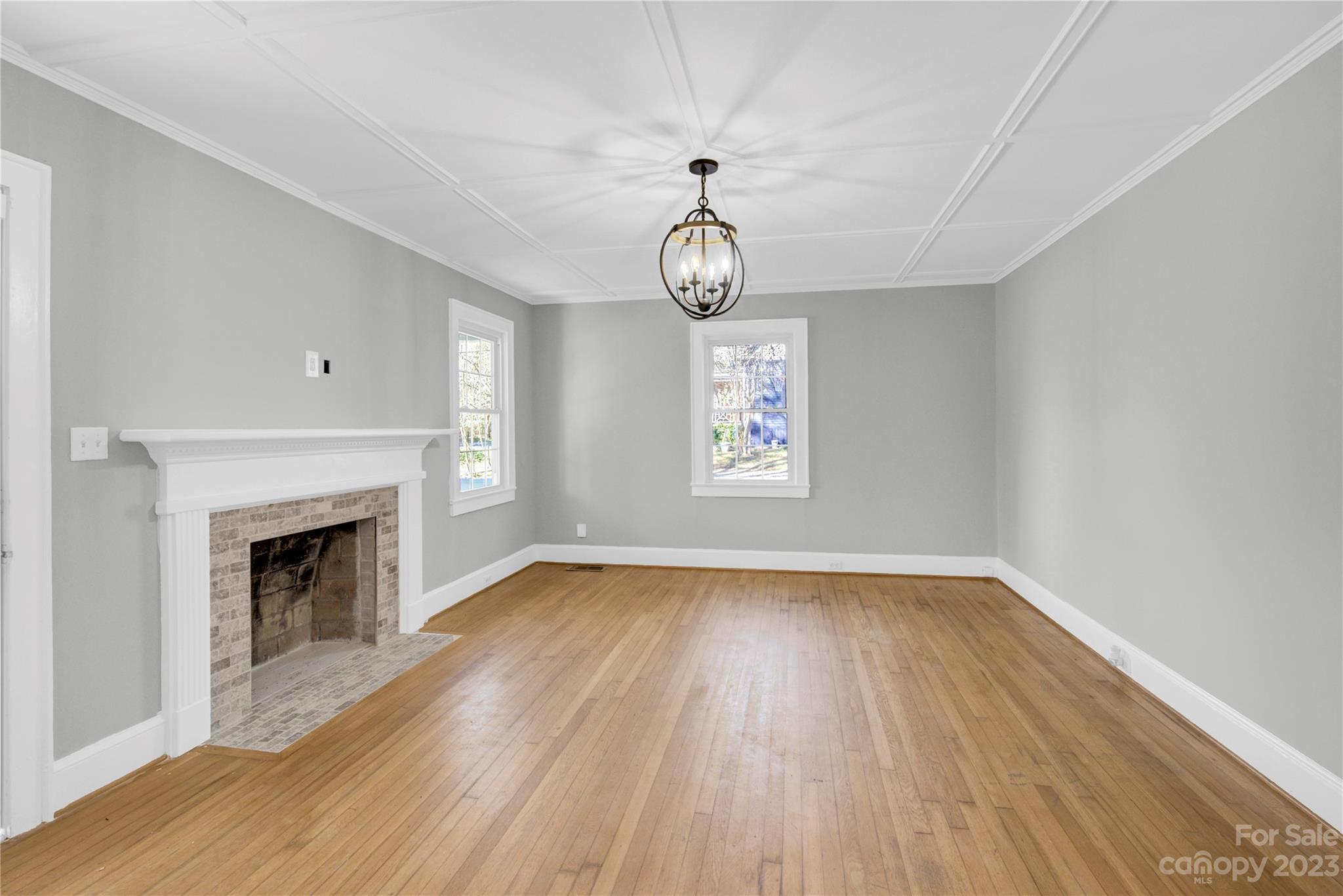 201 Knox Street Clover, SC 29710 - Photo 6 of 34 a view of empty room with wooden floor and fireplace