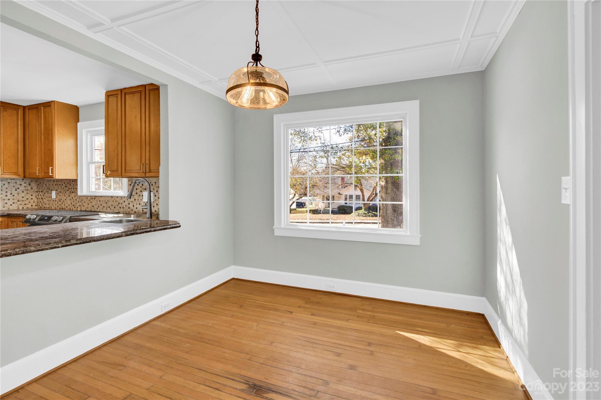 201 Knox Street Clover, SC 29710 - Photo 10 of 34 a view of an empty room with window and wooden floor