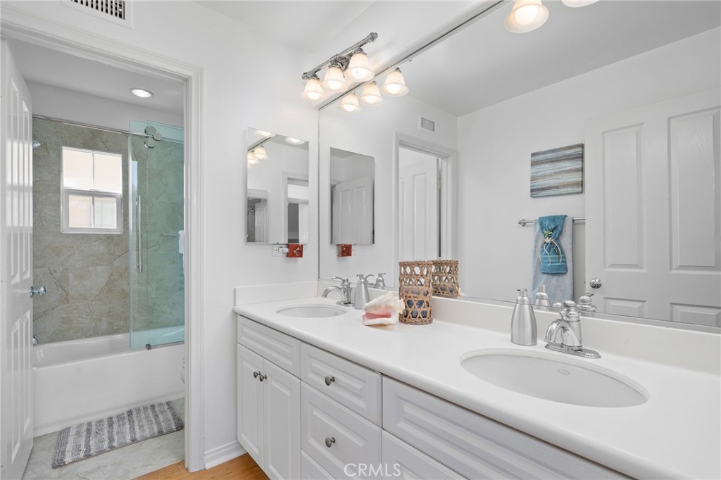 40 Waterspout Irvine, CA 92620 - Photo 19 of 40 Upstairs hall bathroom with dual sinks and separate rooms for tub/shower and toilet.
