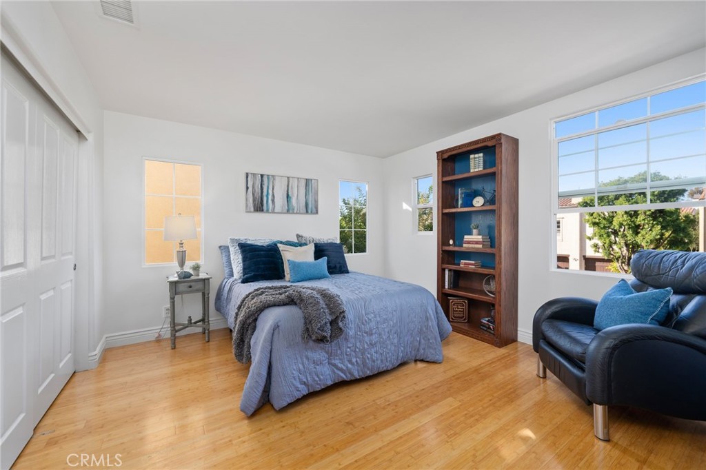 40 Waterspout Irvine, CA 92620 - Photo 19 of 40 a spacious bedroom with a bed a couch and a large window