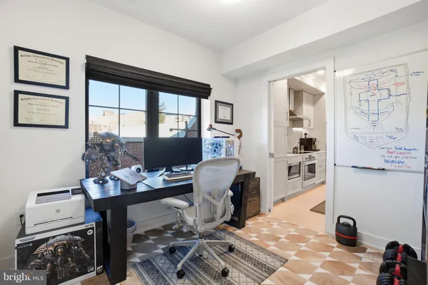 a living room with lots of furniture and baby crib