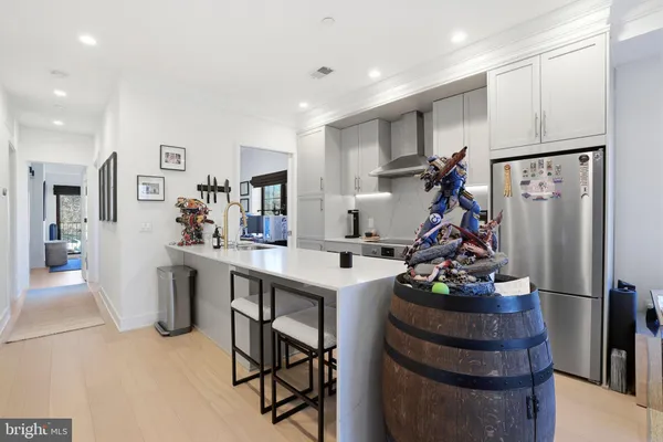 a kitchen with a sink appliances and a counter top space