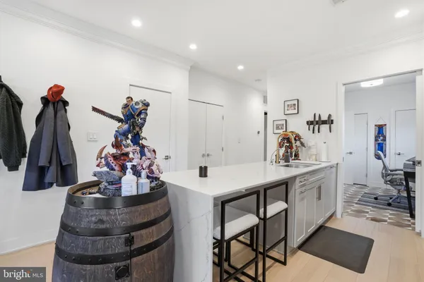 a large kitchen with stainless steel appliances a sink and a large window