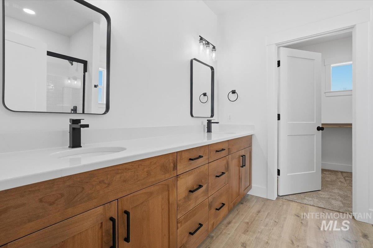 2175 Austin Way Fruitland, ID 83619 - Photo 23 of 30 Bathroom featuring double vanity and light wood finished floors