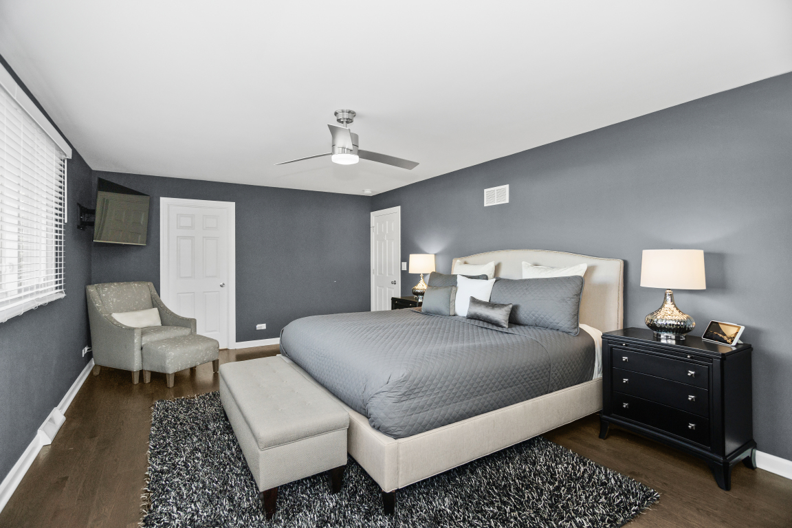1845 Smith Road Northbrook, IL 60062 - Photo 23 of 38 a bedroom with a bed and wooden floor