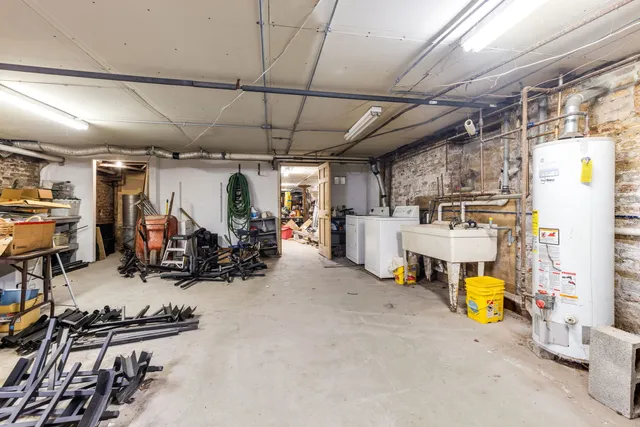a living room with lots of furniture and gym equipment