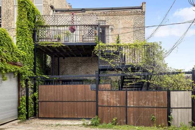 a kitchen with stainless steel appliances a stove a sink and cabinets