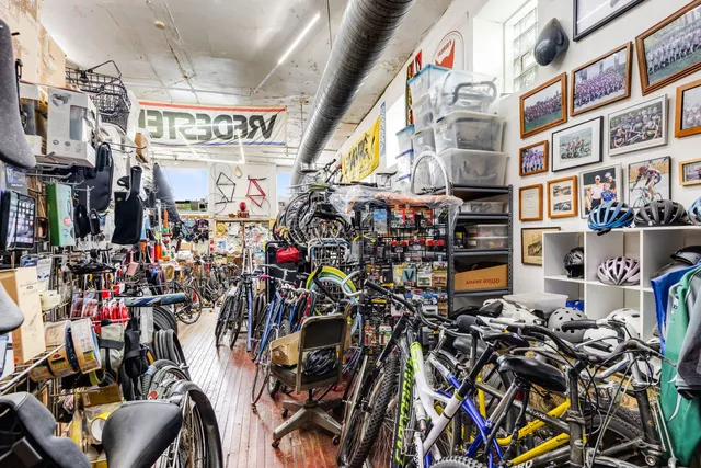 a city street filled with lots of traffic and tall buildings