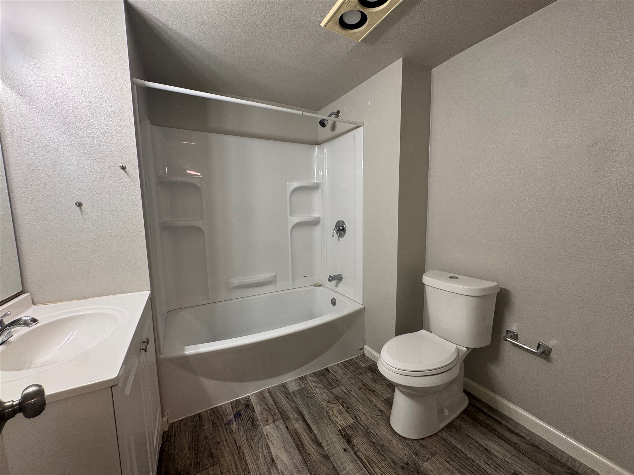 5007 Heflin Lane Austin, TX 78721 - Photo 14 of 25 A well-maintained bathroom with a tub, shower, and sink offers practical comfort.
