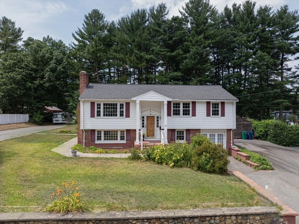 a front view of a house with a yard table and chairs