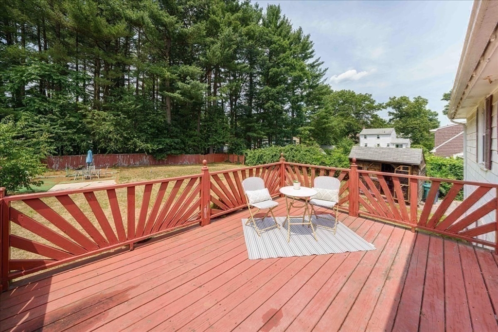 17 Coolidge Street Billerica, MA 01821 - Photo 31 of 32 a balcony with wooden floor table and chairs