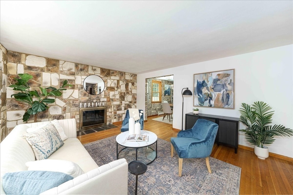 17 Coolidge Street Billerica, MA 01821 - Photo 6 of 32 a living room with furniture and a fireplace