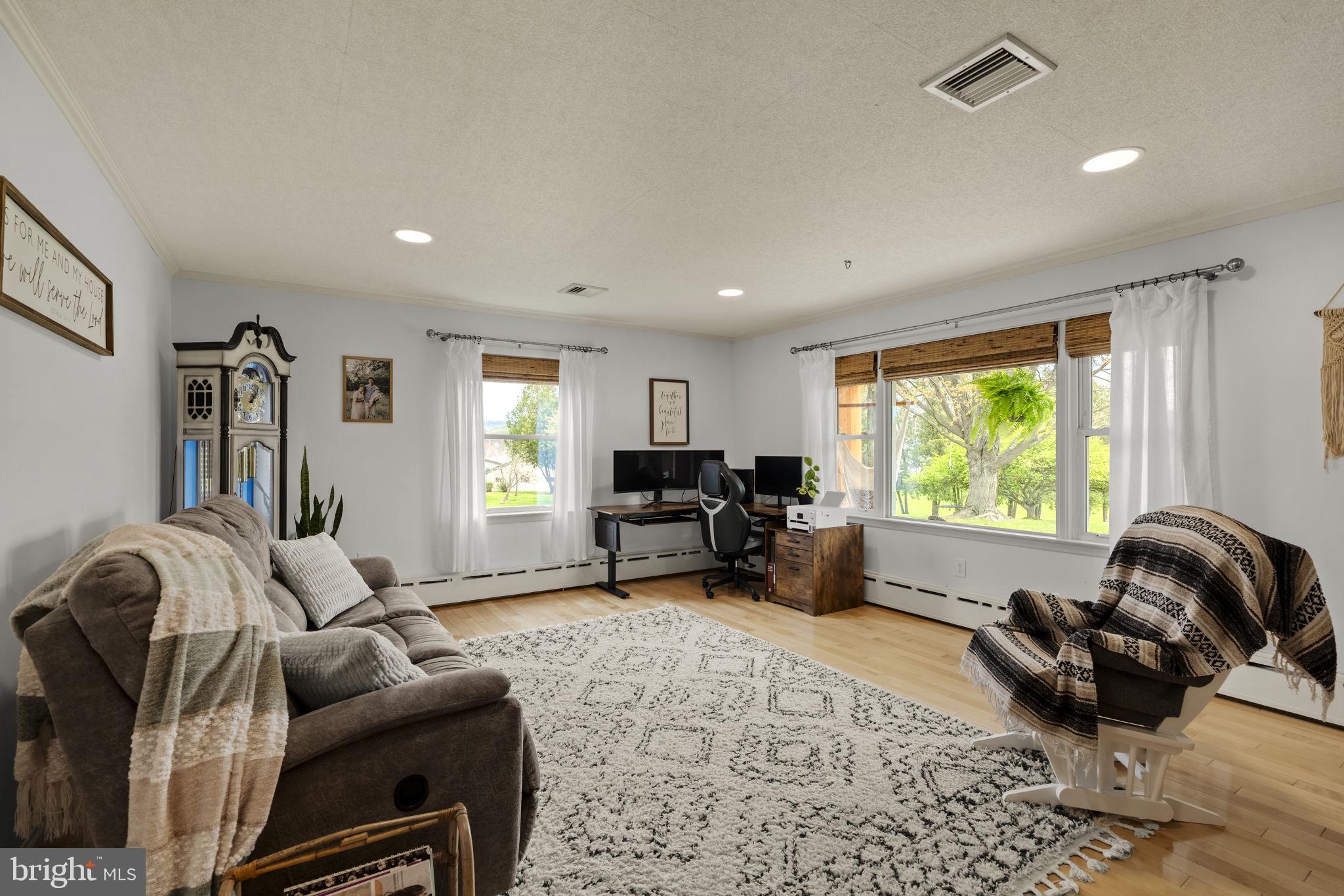 218 Lauschtown Road Denver, PA 17517 - Photo 24 of 78 a living room with furniture and a large window