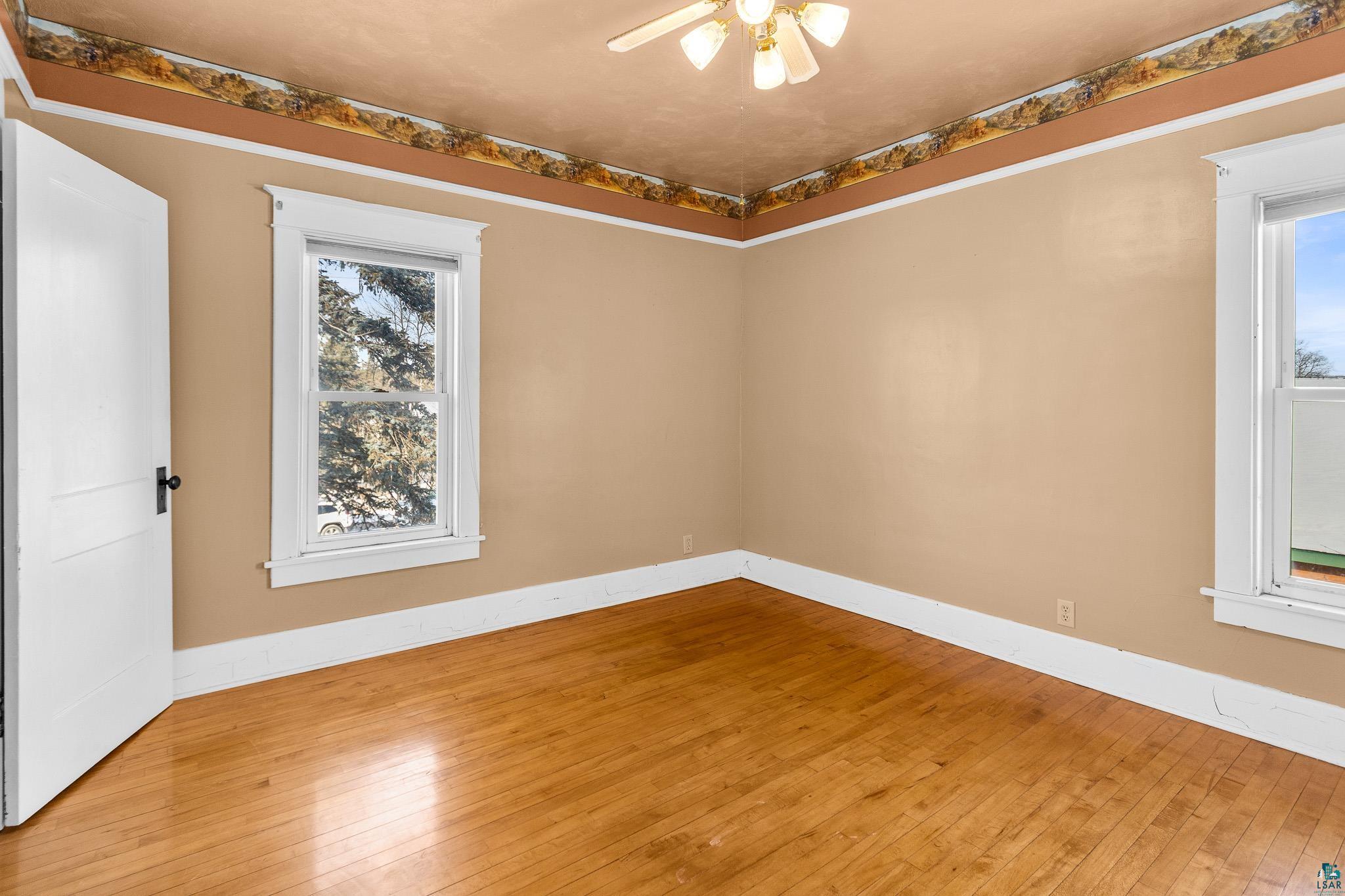 6494 School Street Finlayson, MN 55735 - Photo 12 of 31 Empty room featuring wood-type flooring and ceiling fan
