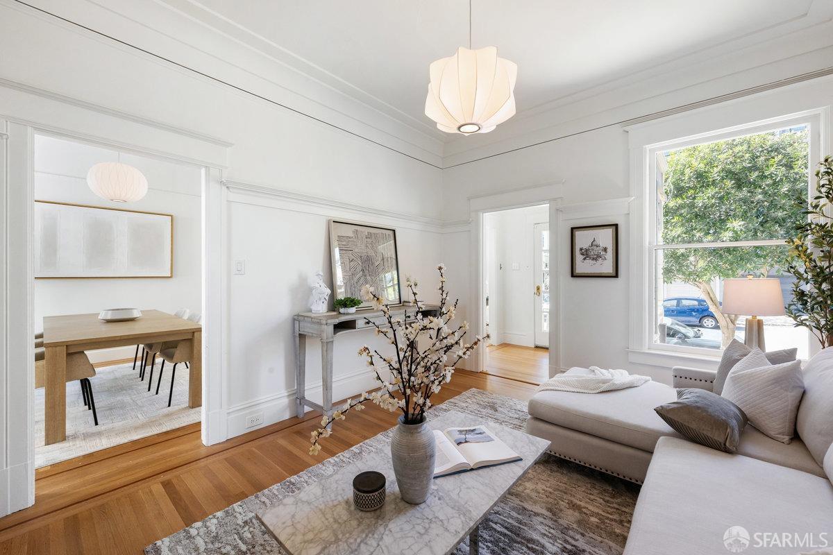 115 Hoffman San Francisco, CA 94114 - Photo 11 of 44 a living room with furniture potted plant and a large window
