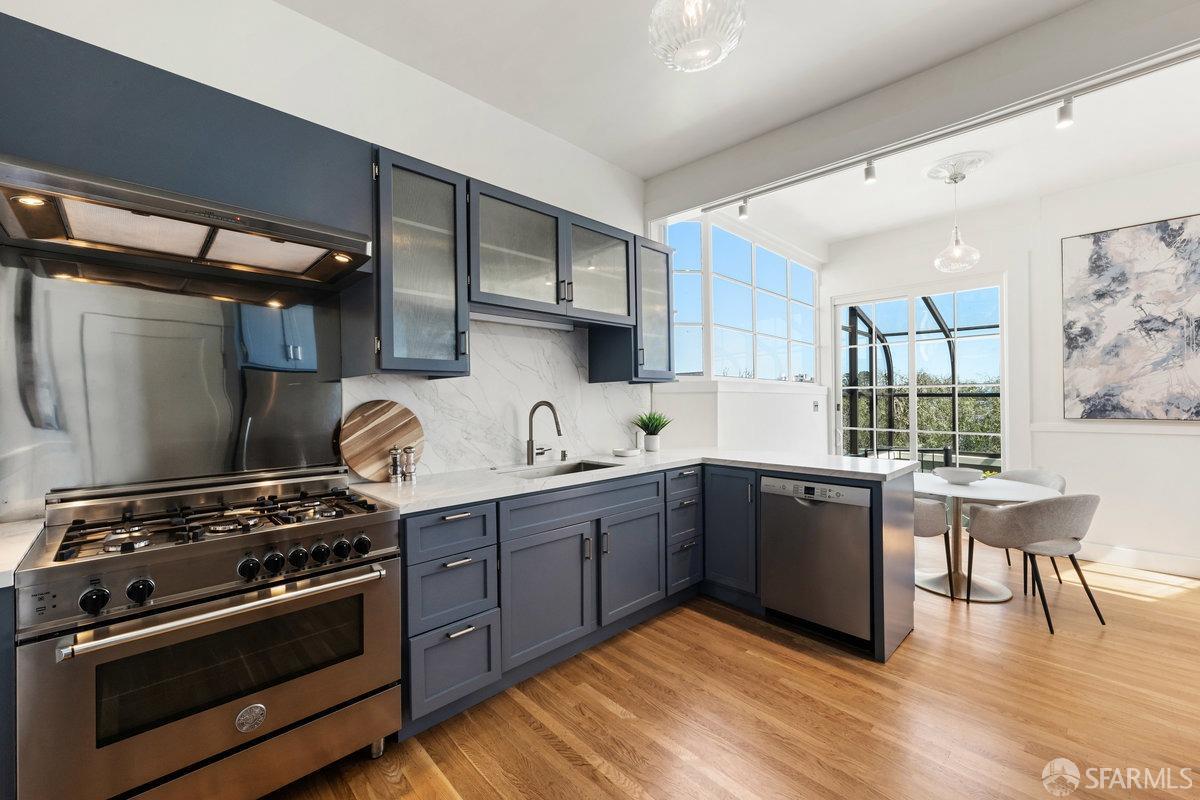 115 Hoffman San Francisco, CA 94114 - Photo 14 of 44 a kitchen with stainless steel appliances granite countertop a stove and a sink