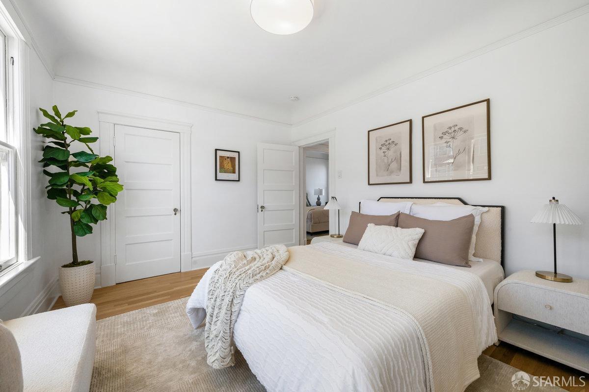 115 Hoffman San Francisco, CA 94114 - Photo 24 of 44 a bedroom with bed and a potted plant