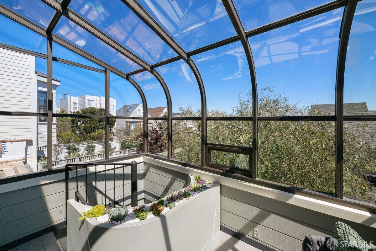 115 Hoffman San Francisco, CA 94114 - Photo 30 of 44 a view of a balcony with furniture and wooden deck