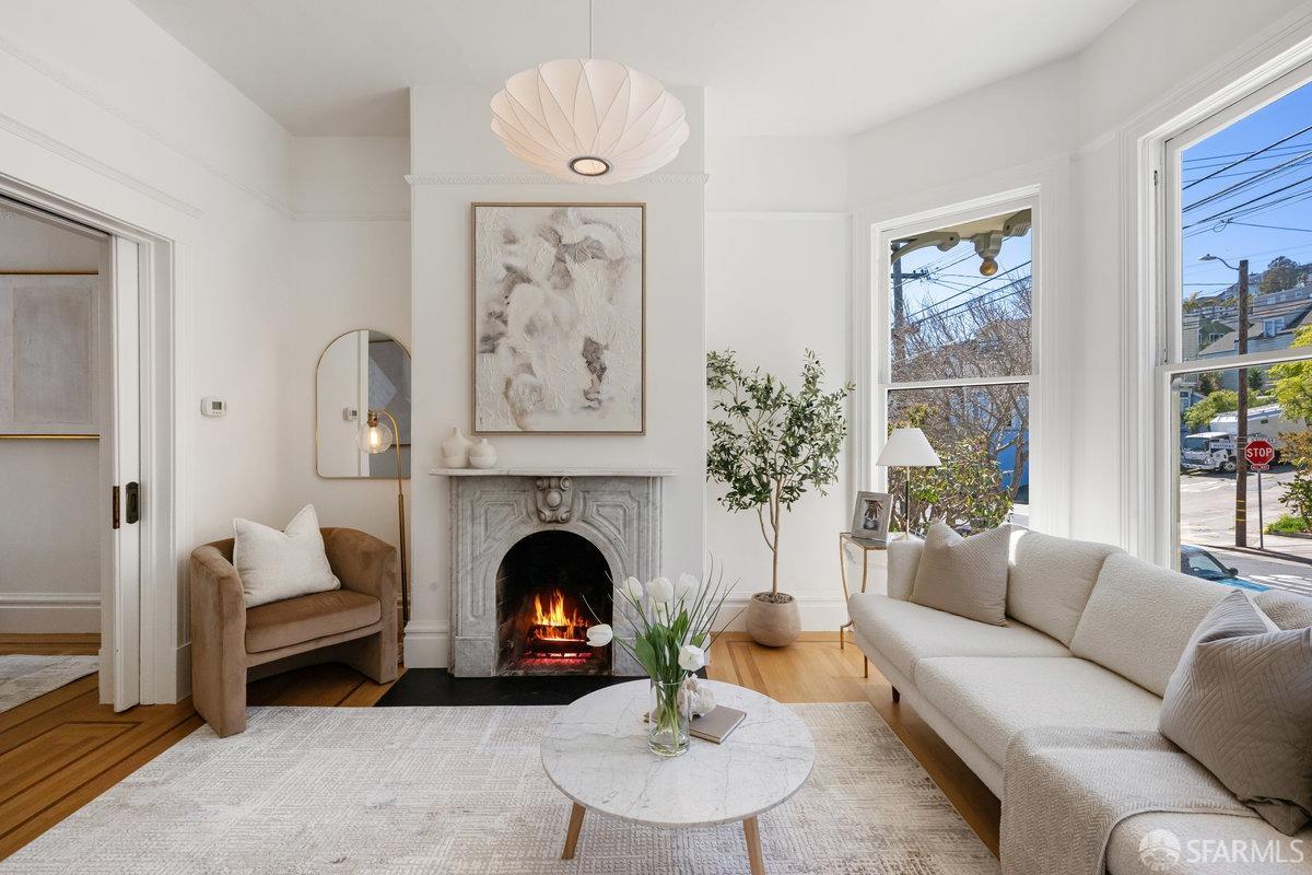 115 Hoffman San Francisco, CA 94114 - Photo 3 of 44 a living room with furniture and a fireplace