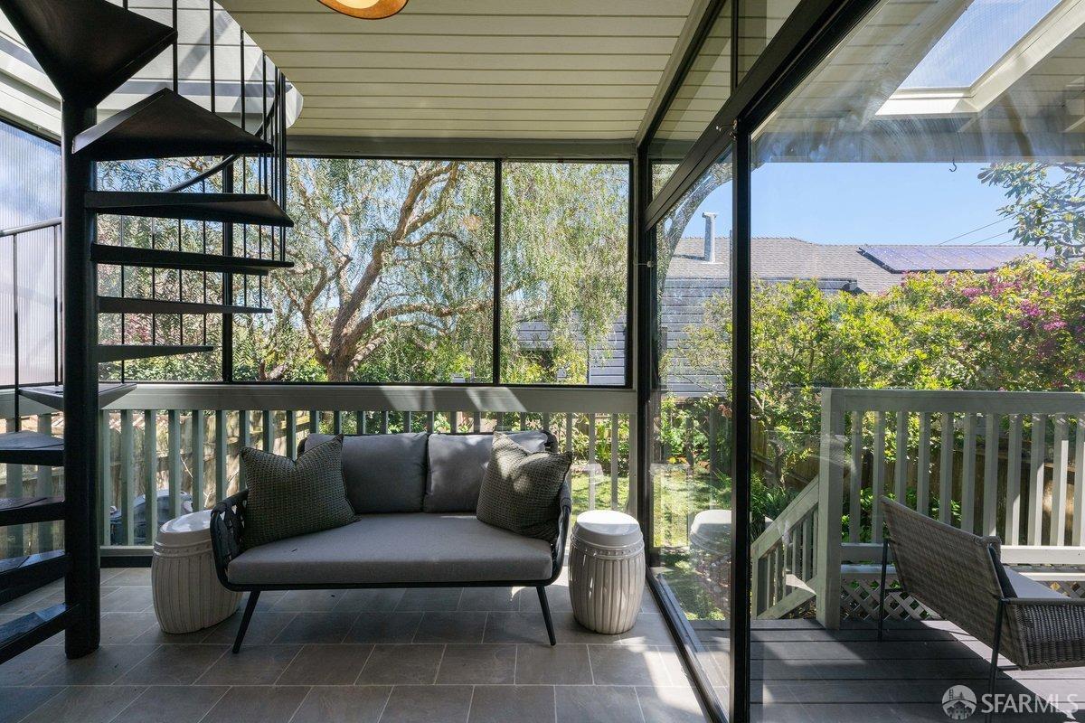 115 Hoffman San Francisco, CA 94114 - Photo 34 of 44 a balcony with wooden floor and outdoor seating