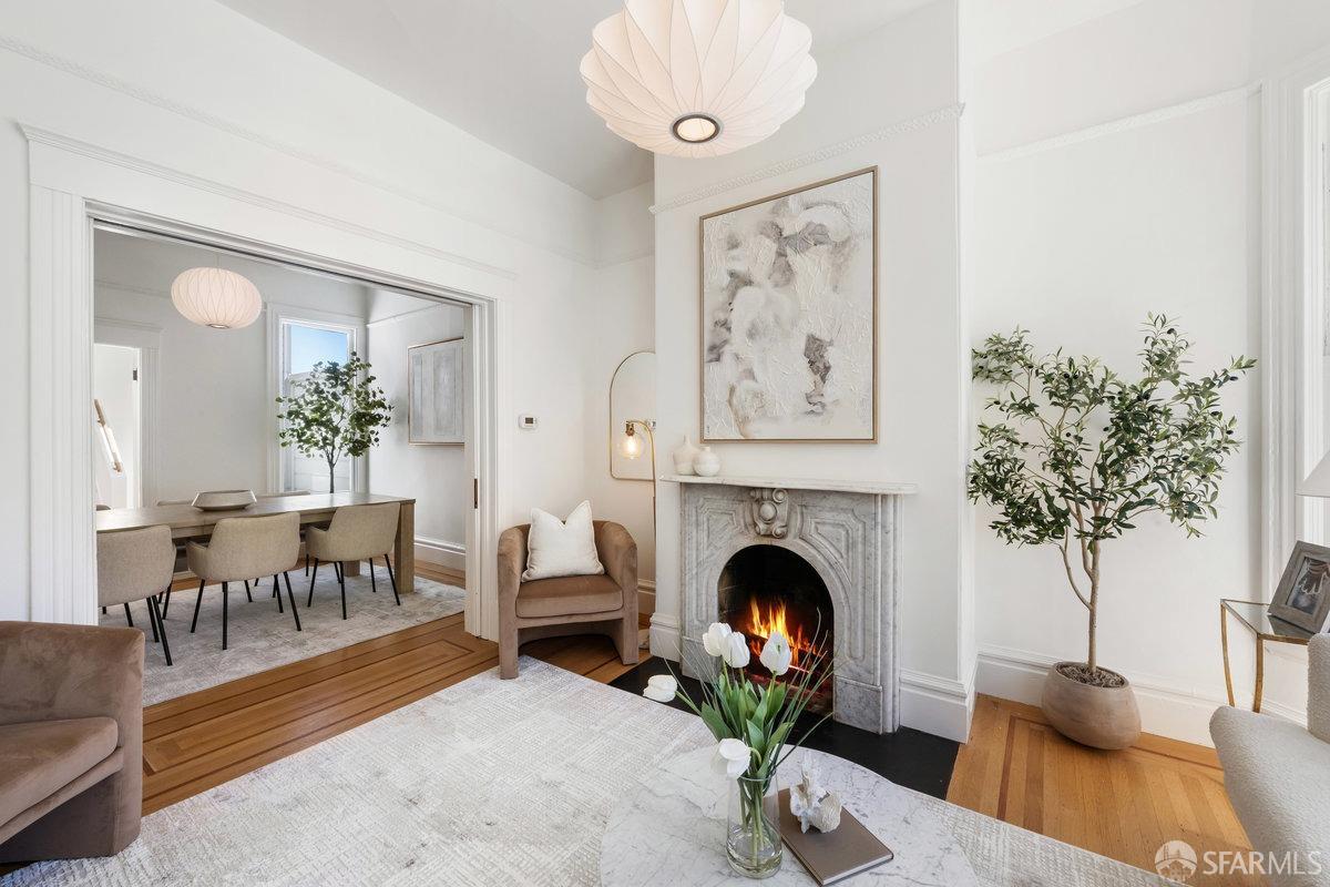 115 Hoffman San Francisco, CA 94114 - Photo 7 of 44 a living room with furniture a potted plant and a fireplace
