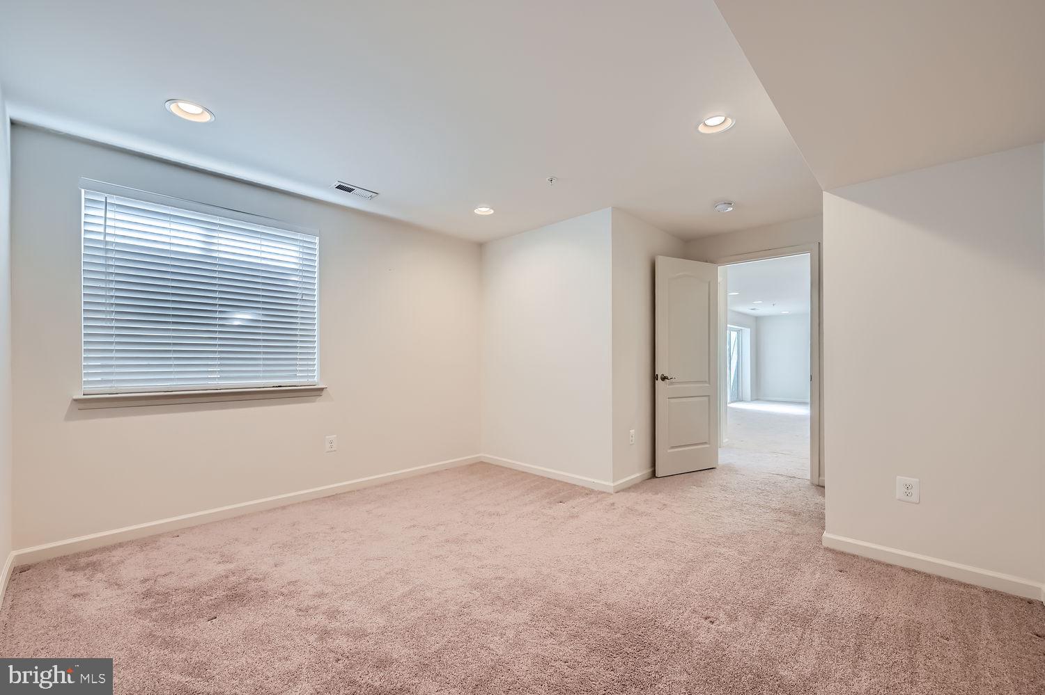 2309 Sweet Meadow Road Baltimore, MD 21209 - Photo 39 of 45 a view of an empty room with a window