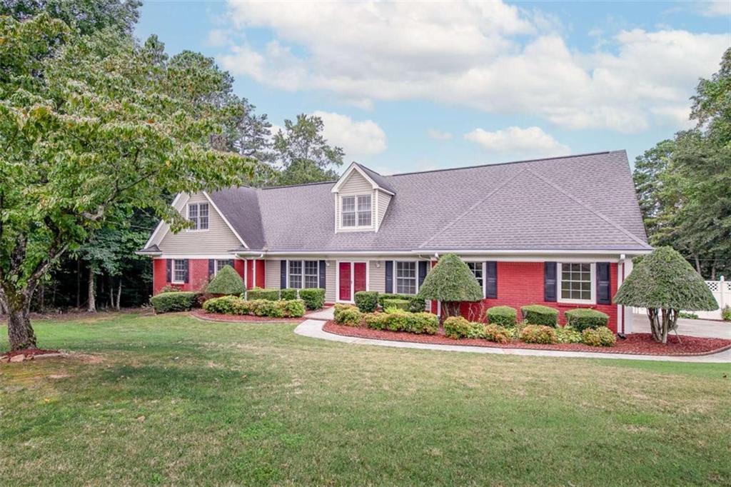2678 North Bogan Road Northeast Buford, GA 30519 - Photo 1 of 52 front view of house with a yard