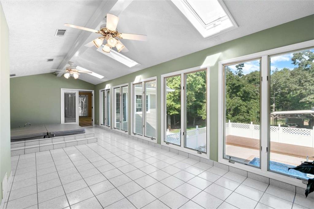 2678 North Bogan Road Northeast Buford, GA 30519 - Photo 11 of 52 a view of an entryway with a ceiling fan and windows