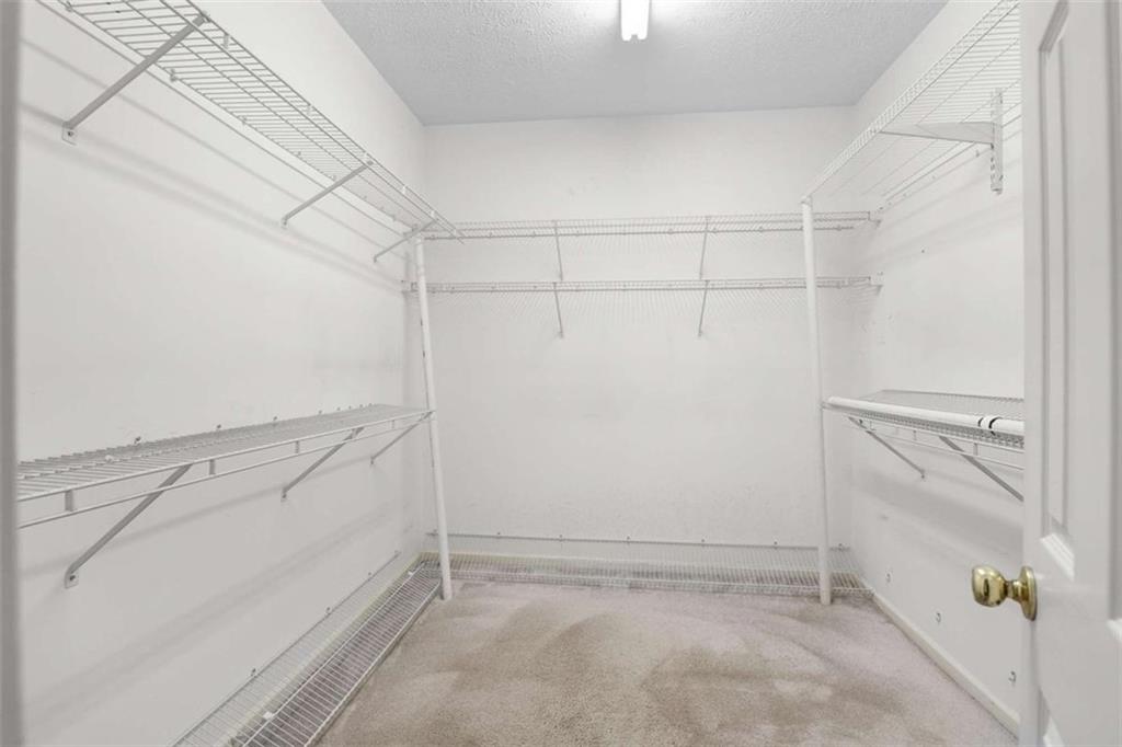 2678 North Bogan Road Northeast Buford, GA 30519 - Photo 17 of 52 a view of a room with racks on the wall