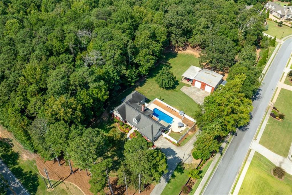 2678 North Bogan Road Northeast Buford, GA 30519 - Photo 2 of 52 an aerial view of a house with a yard